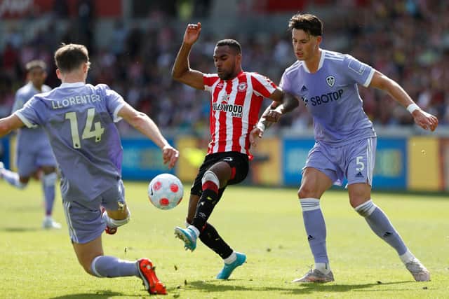 SAFE: Leeds United's Robin Koch, right, and Diego Llorente, left, battle it out with Brentford's Rico Henry in Sunday's season finale in which the Whites assured Premier League survival. Photo by ADRIAN DENNIS/AFP via Getty Images.