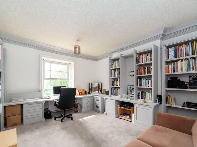 A room suitable as a study, office or library, with inbuilt shelving.