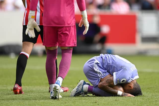 GIVING THANKS - Leeds United's survival prompted Raphinha to walk down Brentford's pitch on his knees. Pic: Getty