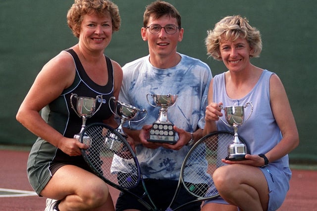 Upper Armley tennis club members are pictured with their trophies in July 1999. Pictured, from left, are Dorcas Dupin (ladies single and double winner for the third year running), Stuart Pedder (mens single winner for the secondyear running) and Heather Senior (ladies doubles winner for the third year running).