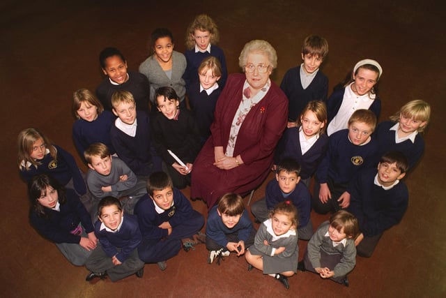 Joan Sanderson with some of the pupils of Castleton Primary in December 1995.  She was retiring after 33 years at the school.