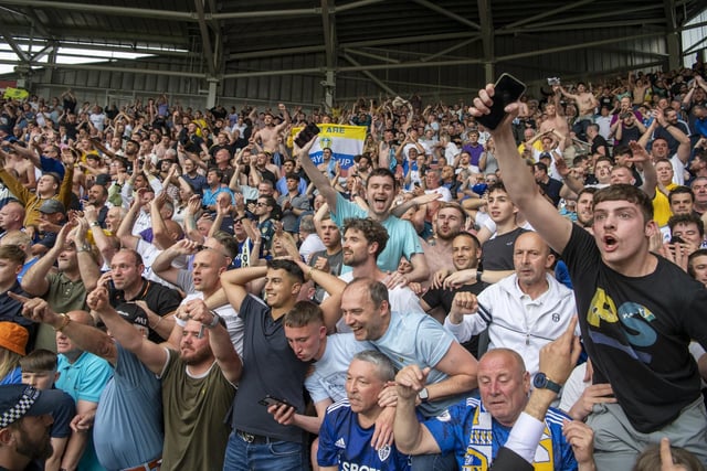 FT - Leeds United fans celebrate the Whites' survival at the Brentford Community Stadium.