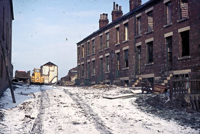 Primrose Walk when slum clearance of the brick terraced housing was in progress in March 1962. This street, off Old Road, was known as 'Sparrow Barracks'. The houses were built for miners who came to work in the new coal mines in the middle of the 19th century.