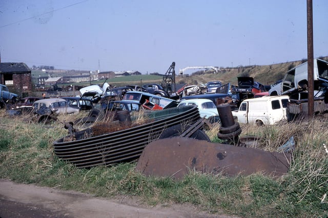 The car wrecker's yard at Tan House in April 1968. The sign on the old derelict brick building is an advertisement for the Payne Brothers.