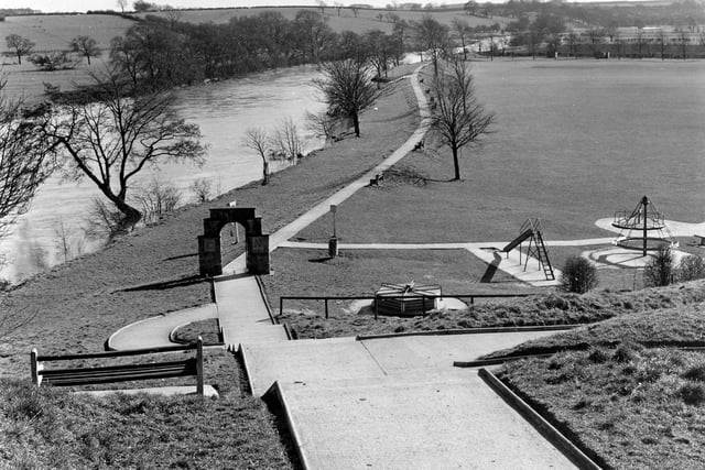 Scaur Bank in an area known as the Ings (Linton Ings) which stretches between the River Wharfe and Linton Road in April 1962. This is the King George V Playing Fields with childrens' play apparatus laid out beside the river.