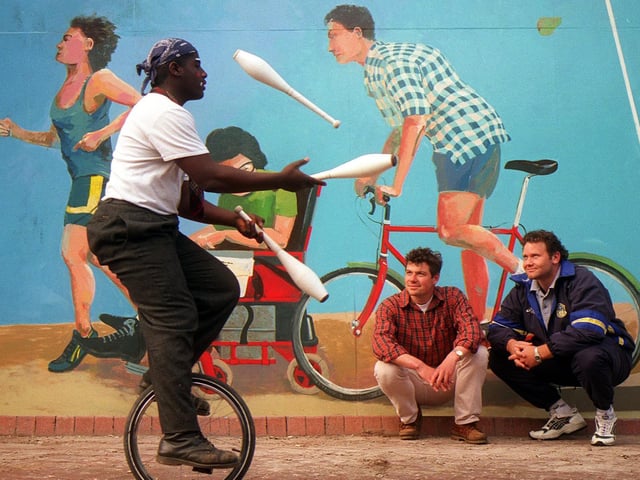 The Pacesetters Waterfront Mural, behind the Corn Exchange was unveiled. Four murals have been painted, each has its own health related image to illustrate the theme 'positive images of health'. Pictured enjoying the celebrations are, from left, French artist, Slim Nebigh, the artist Alan Pergusey, and Leeds RL player Neil Harmon.