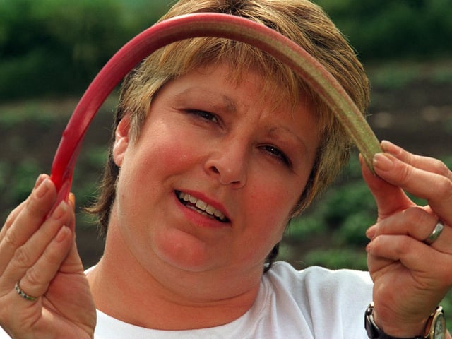 A new EC ruling stated that rhubarb should be sold straight. Pictured is Janet Oldroyd-Hulme, a director for E.Oldroyd and Sons Ltd, holding a piece of curling rhubarb in one of their fields at Carlton.
