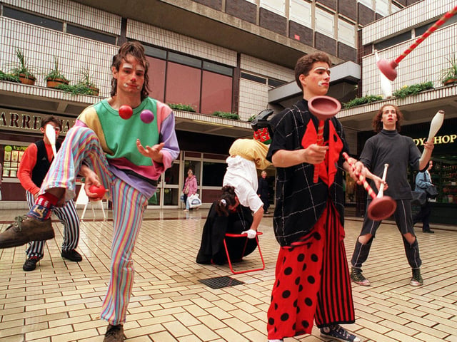French Clowns juggling in Leeds city centre as part of the Music, Fire and Masks Festival organised by Leeds City Council.