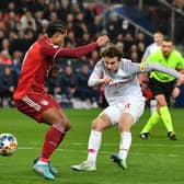 TOP LEVEL: Brenden Aaronson, right, fires in a shot under pressure from Serge Gnabry, centre, in the Champions League last-16 clash between RB Salzburg and Bayern Munich in February of this year. Photo by KERSTIN JOENSSON/AFP via Getty Images.