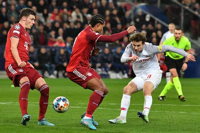 TOP LEVEL: Brenden Aaronson, right, fires in a shot under pressure from Serge Gnabry, centre, in the Champions League last-16 clash between RB Salzburg and Bayern Munich in February of this year. Photo by KERSTIN JOENSSON/AFP via Getty Images.