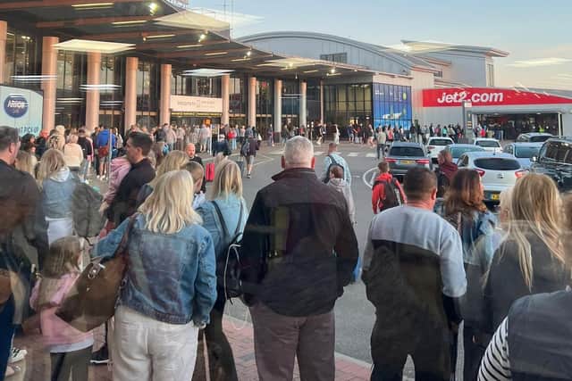 The man - under the Twitter handle @WoodsyLufc - shared shocking pictures of huge queues snaking outside the terminal in the early hours of Saturday.