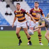 Cain Robb slips out a pass during Tigers' Super League defeat at Huddersfield Giants this season. Picture by Alex Whitehead/SWpix.com.