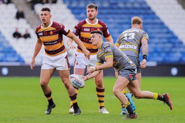 Cain Robb slips out a pass during Tigers' Super League defeat at Huddersfield Giants this season. Picture by Alex Whitehead/SWpix.com.