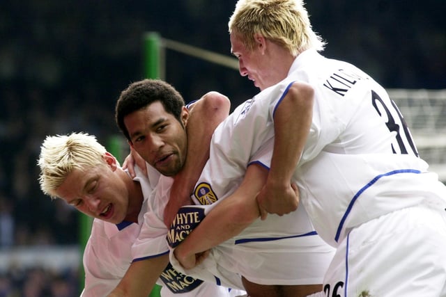 Jermaine Pennant is mobbed by teammates Alan Smith and Matthew Kilgallon after scoring.