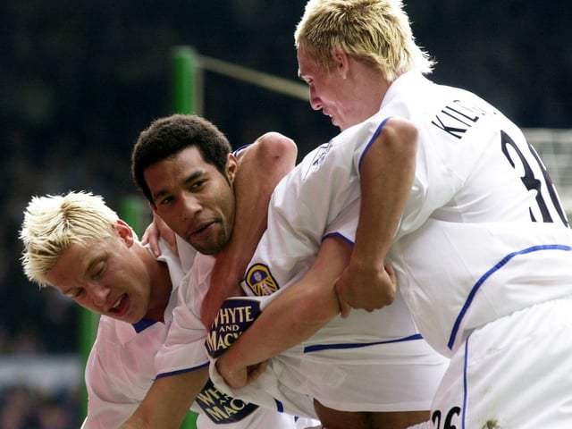 Jermaine Pennant is mobbed by teammates Alan Smith and Matthew Kilgallon after scoring.