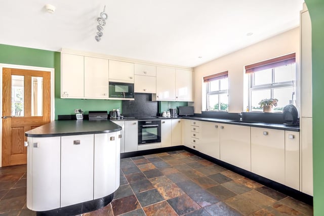 The house benefits from an open plan kitchen diner and private landscaped gardens with a double detached garage.