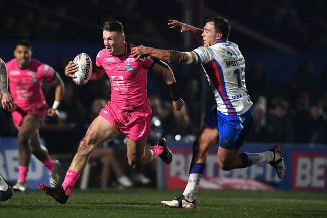 Leeds Rhinos' Harry Newman gets away from Wakefield Trinity's Jai Whitbread. The Rhinos will be hugely boosted by his return from injury says Gary Hetherington. 
Picture: Jonathan Gawthorpe.