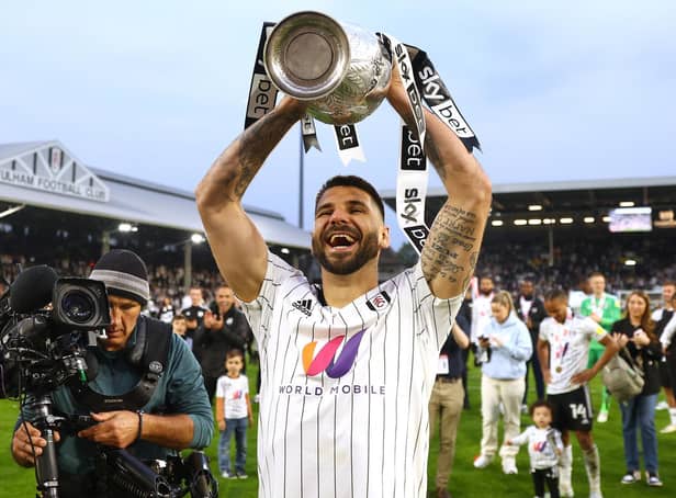 Fulham's top scorer Aleksandar Mitrović celebrates with the Championship trophy. Pic: Clive Rose.