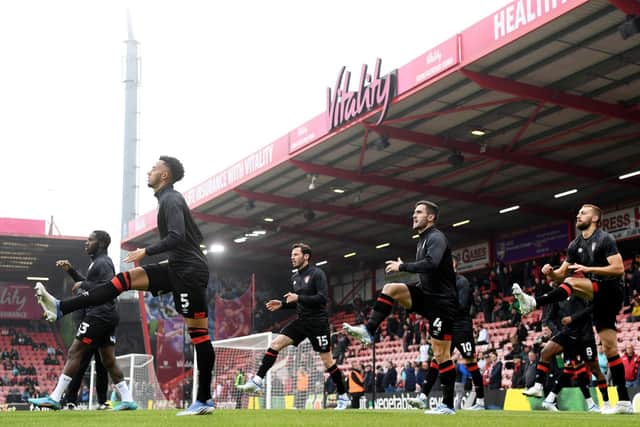 Bournemouth warm up at the Vitality Stadium. Pic: Mike Hewitt.
