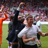 MISSION ACCOMPLISHED: Leeds United's director of football Victor Orta, centre, hails Whites boss Jesse Marsch, right, after the 'great escape' Premier League survival on the final day at Brentford.Photo by ADRIAN DENNIS/AFP via Getty Images.