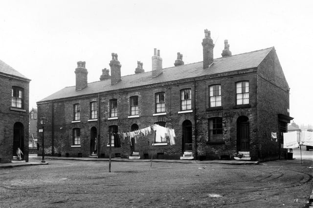 Macedo Square in April 1959.  The shop just visible on the right end is Sowden's, a greengrocers.