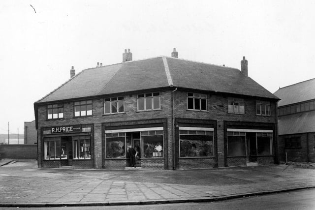 A parade of shops on Belle Isle Road viewed from Moor Road in March 1951. To the left can be seen R.H. Price, butcher.