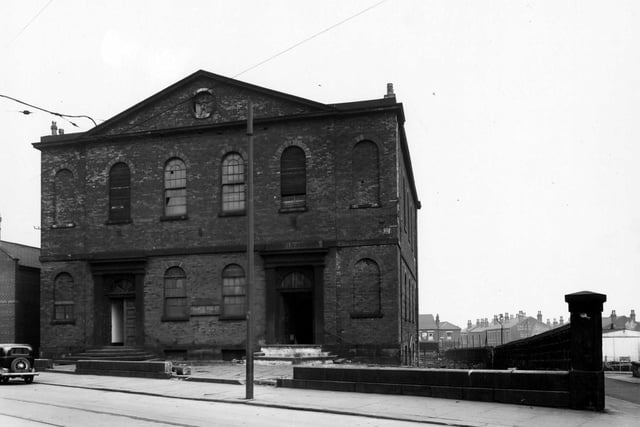 Waterloo Road Chapel at its junction of Waterloo Road and Whitfield Street in April 1950. The chapel appears disused, and has a faded sign reading 'Francis Fox & Co. (Leeds) Ltd.