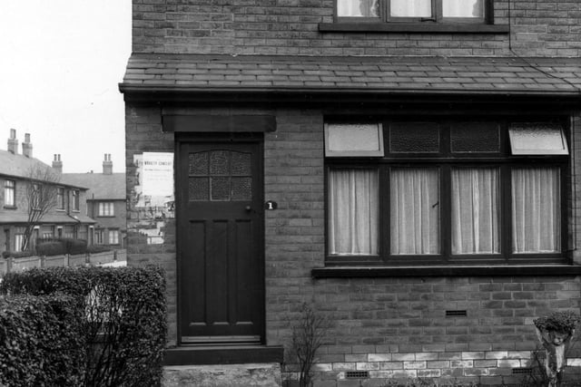 A house on Parnaby Terrace in April 1955. The house is a through terrace with a small front garden containing a bird bath and a statue of a boy holding flowers.