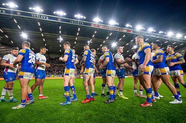 Rhinos players shake hands with opponents Wakefield Trinity after the Super League round 13 derby. Picture by Allan McKenzie/SWpix.com.