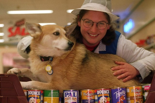 Shop worker Vanessa Krasowski at Super C supermarket with Cyril the dog. She is pictured in January 1997 with some of the dog and cat food customers at the store collected for charity.