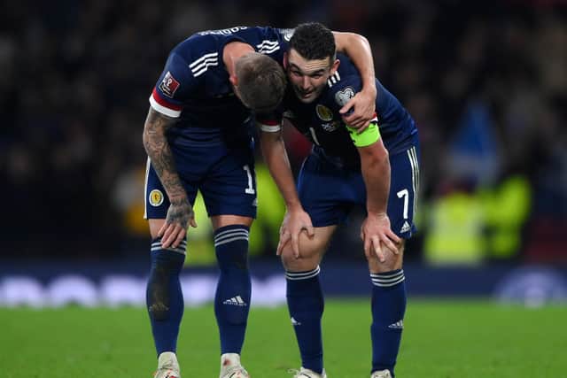 Liam Cooper puts his arm around John McGinn after Scotland claimed a 2-0 win over Denmark in Glasgow in November 2021. Pic: Stu Forster.