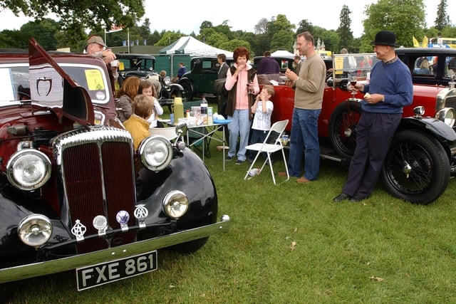 The Classic Car Motor Show was held at Harewood House in June 2004. Pictured are  the Drake, Bridges and Farrand families enjoying a picnic between their 1939 Daimler and 1924 Sunbeam 14/14.