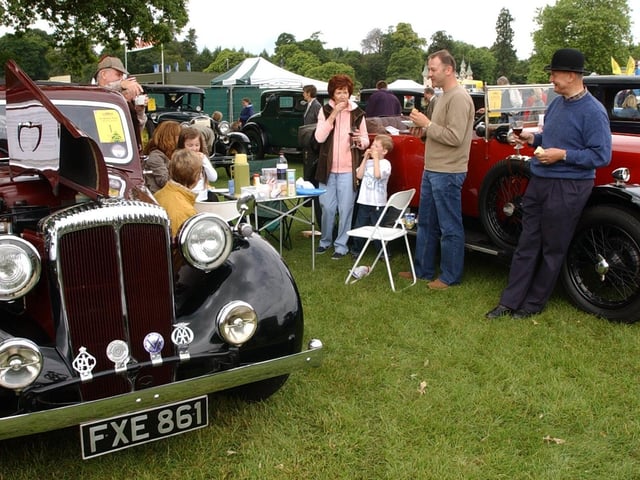 The Classic Car Motor Show was held at Harewood House in June 2004. Pictured are  the Drake, Bridges and Farrand families enjoying a picnic between their 1939 Daimler and 1924 Sunbeam 14/14.