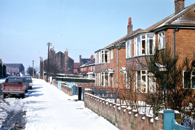 Springfield Lane looking towards Springfield Mill at the bottom of the lane. The image shows three periods of housing development.