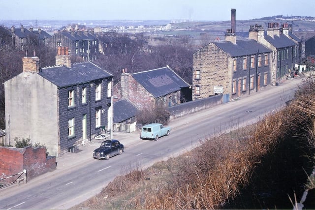 Albert Road from Troy Road in April 1969. Some of the houses look to have extra storeys at the back which would take them down to ground level on Station Road. In the distance there is much new housing at Middleton, and Skelton Grange power station is visible.