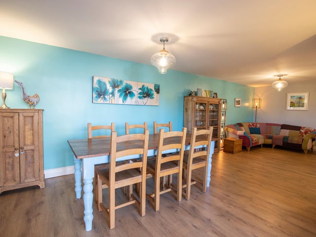 Space galore, with the dining area adjoining a comfortable corner with seating.