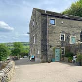 The attractive property, for sale at £550,000, has a high vantage point above the Calder Valley.