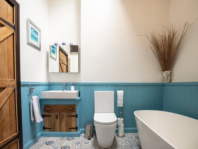 One of the stylish bathrooms, with a deep bath tub.
