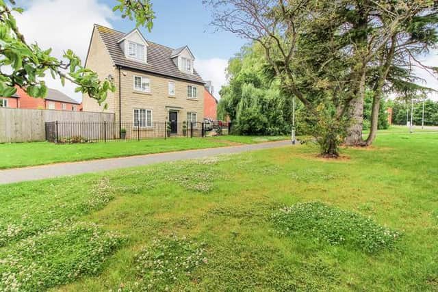 This five bedroom detached house (pictured) in Whinmoor is now for sale on Purple Bricks for an asking price of £475,000. Photo: Purple Bricks