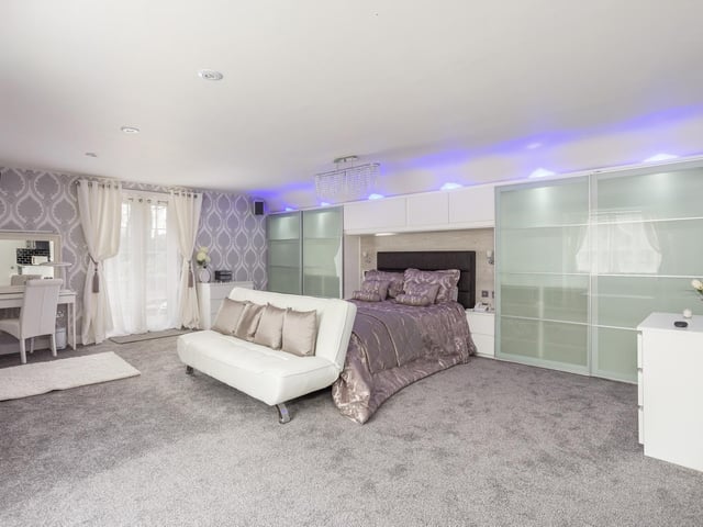 Upstairs there are eight bedrooms, including most notably, a stunning principal bedroom suite including a fitted dressing room, wet bar/kitchenette and en suite bath/shower room.