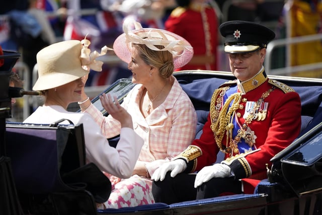 The Earl and Countess of Wessex ride in a carriage as the Royal Procession leaves Buckingham Palace for the Trooping the Colour ceremony