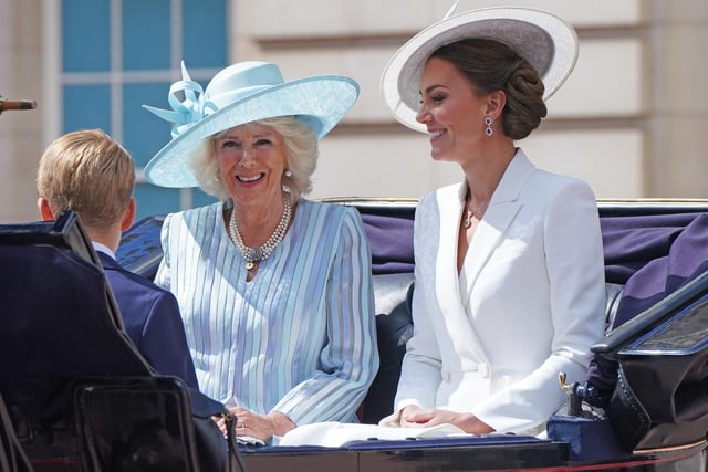 The Duchess of Cornwall and the Duchess of Cambridge ride in a carriage as the Royal Procession leaves Buckingham Palace for the Trooping the Colour ceremony at Horse Guards Parade.