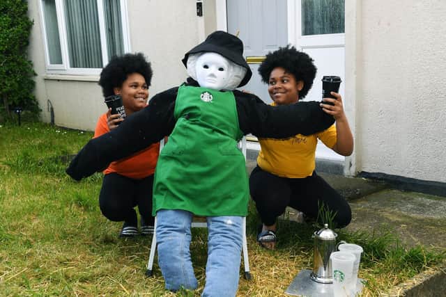 Pictured are twins Iyahra and Kehzia Da-Gama with their scarecrow (Photo: Jonathan Gawthorpe)