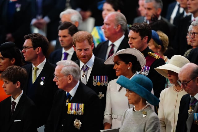 Prince Harry and his wife Meghan, the Duke and Duchess of Sussex, take their seats at Saint Paul's Cathedral for the National Service of Thanksgiving for The Queen's reign.