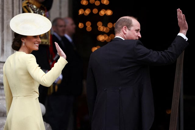 Prince William and Catherine, the Duke and Duchess of Cambridge, wave as they arrive to the National Service of Thanksgiving for The Queen's reign at Saint Paul's Cathedral in London.