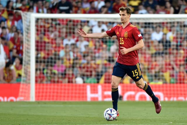 SOLID: Leeds United's Diego Llorente carries the ball forward for Spain during Thursday night's 1-1 draw against Nations League visitors Portugal in Seville.
Photo by CRISTINA QUICLER/AFP via Getty Images.