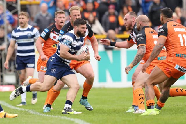 Castleford Tigers' Nathan Massey, second from right, prepares to tackle 
Wigan Warriors' Abbas Miski. Picture: John Clifton/SWpix.com.