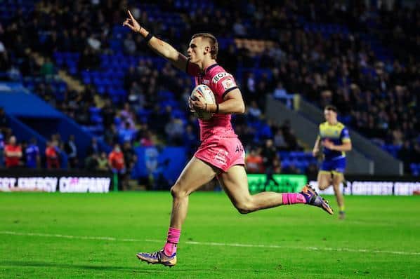 Ash Handley celebrates as he crosses for his sercond try in Rhinos' big win at Warrington. Picture by Alex Whitehead/SWpix.com.