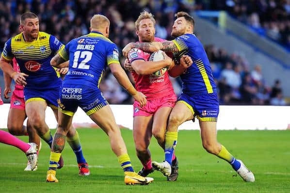 Matt Prior tackled by Warrington's Daryl Clark. Picture by Alex Whitehead/SWpix.com.