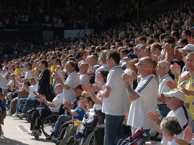 The Kop stands to appluad during a tribute to Alan Ball ahead of kick-off.